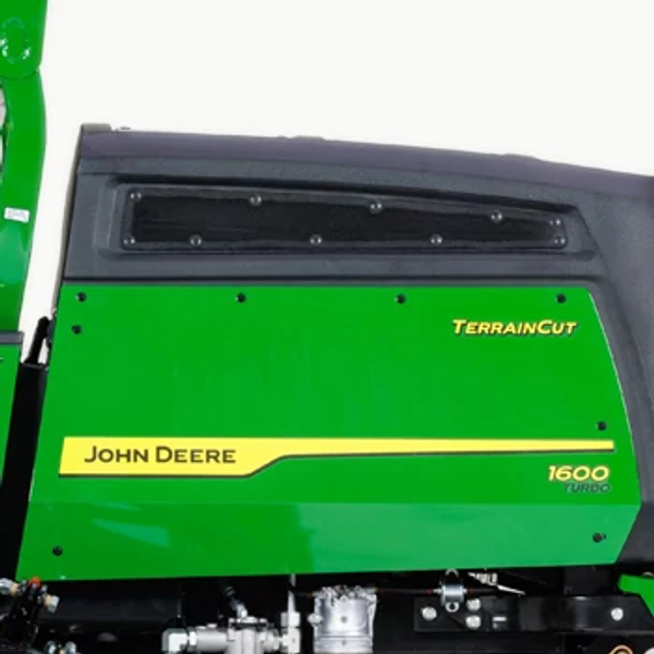 Side left studio view of a 1600 Turbo TerrainCut Wide-Area Mower's green engine cover with black, top air-intake system