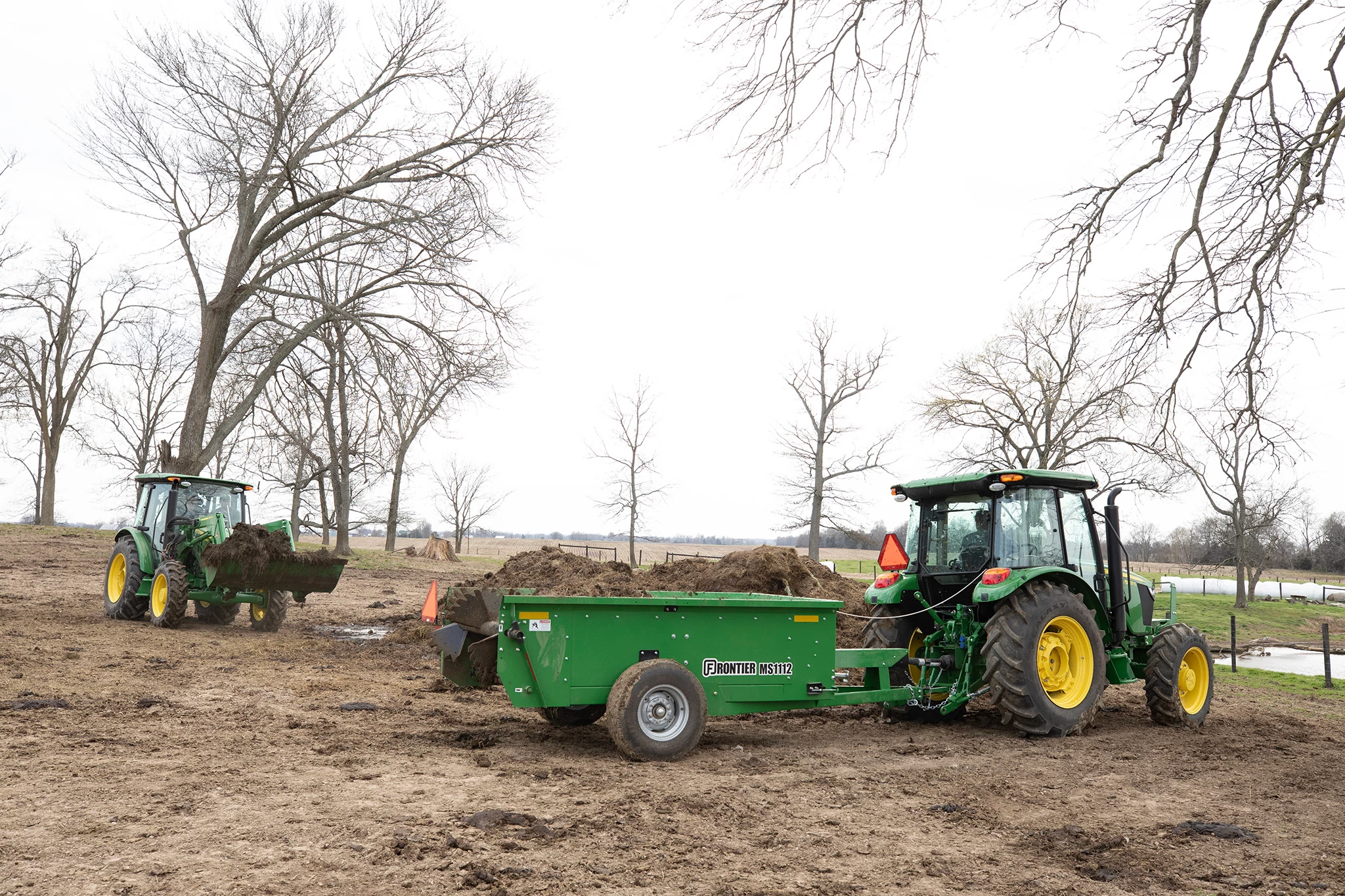 MS1112 Manure Spreader on 5 series Tractor in field
