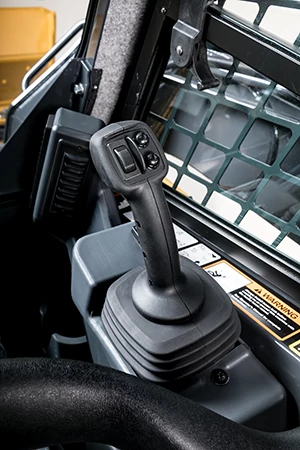 Right-hand EH joystick control in the operator station of a compact track loader.