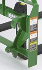 Studio close-up of Deere's global attaching system, comprised of green-painted metal bars