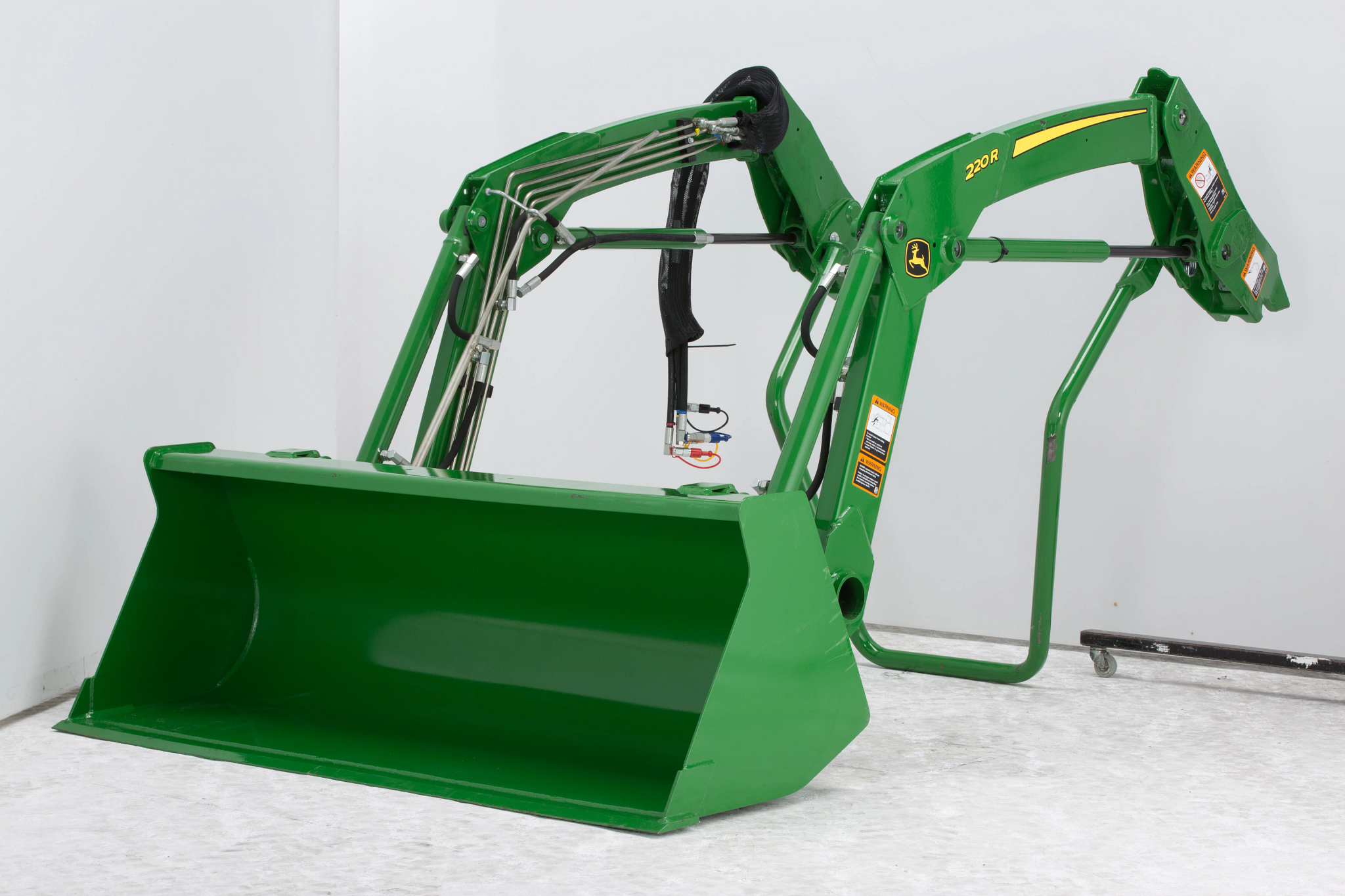 Front left studio view of a 220R loader in Quik-Park™ mounting position