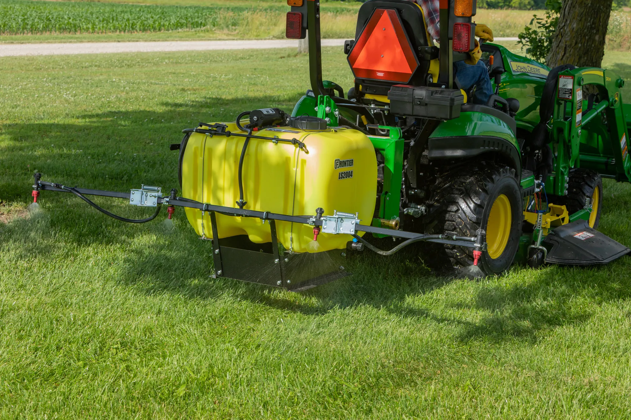 Frontier LS2004 3-Point Mounted Liquid Sprayer on a tractor in the field