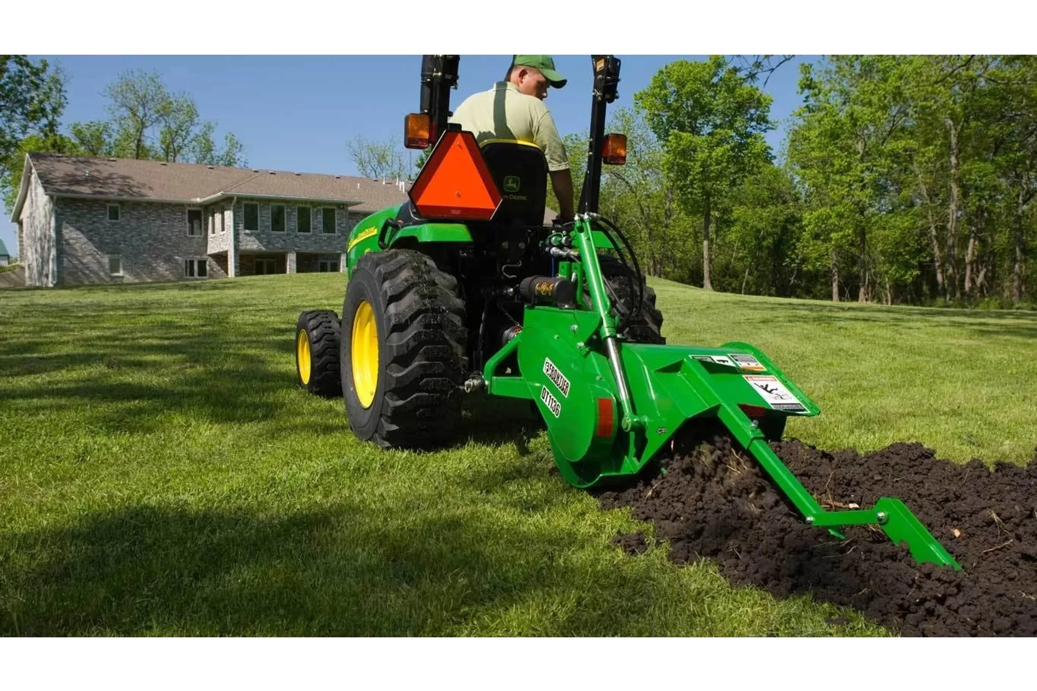 Homeowner using a DT11 Series Trencher to dig a trench in their yard