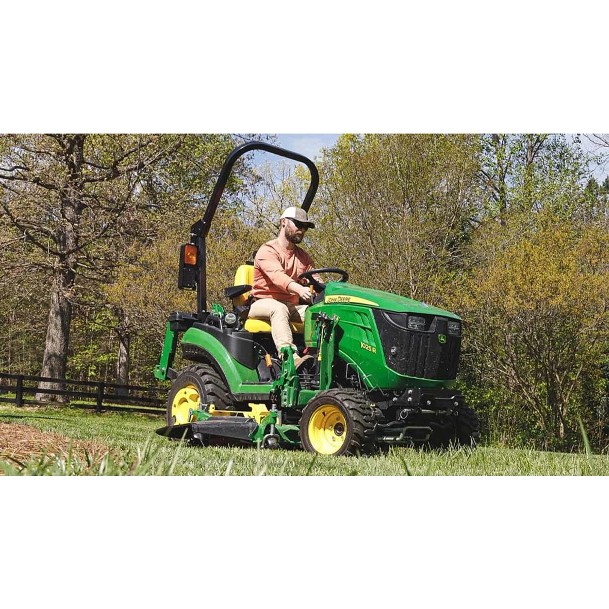 John Deere 1025R sub-compact tractor at work in the field — Koenig Equipment