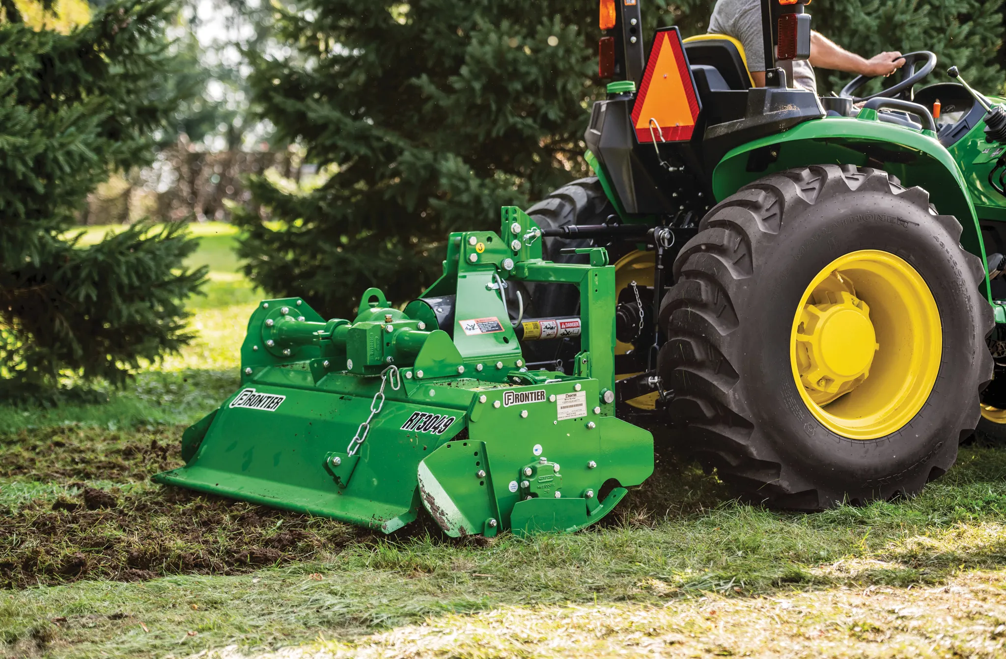 Side view of the RT3049 Rotary Tiller working up ground