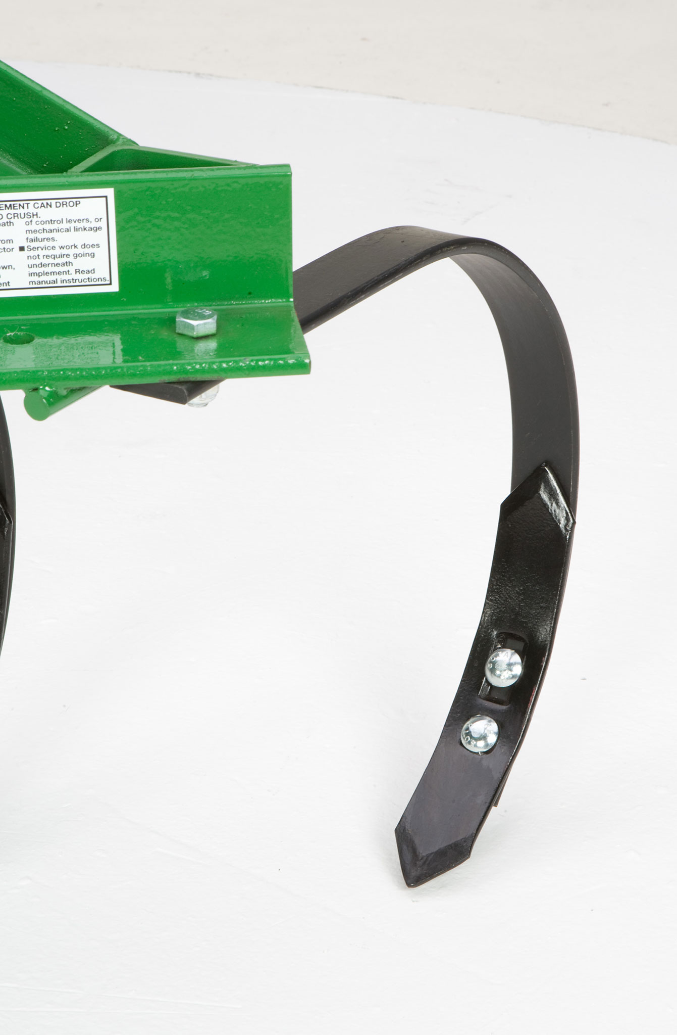 Front left studio closeup of adjustable C-tine on PC10 Cultivator