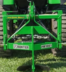 Front view of a PM1001 integral middle buster attached to the back of a tractor