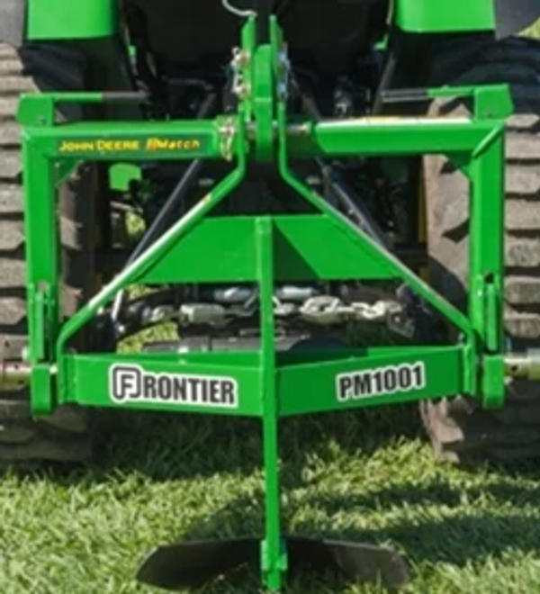 Front view of a PM1001 integral middle buster attached to the back of a tractor