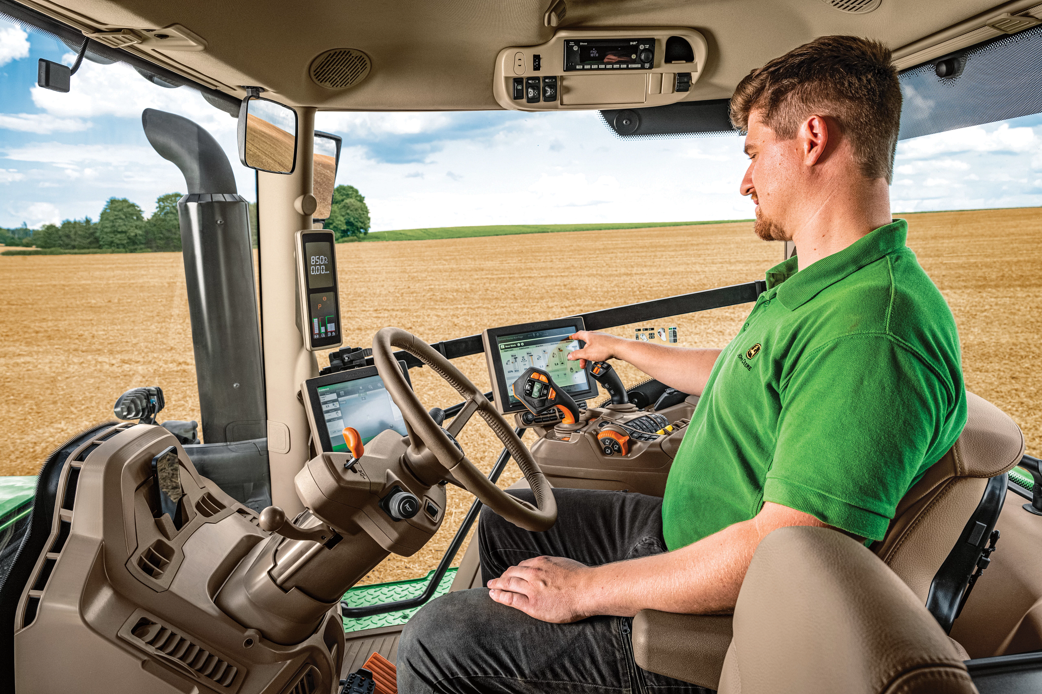 Interior view of an operator inside a cab in the field