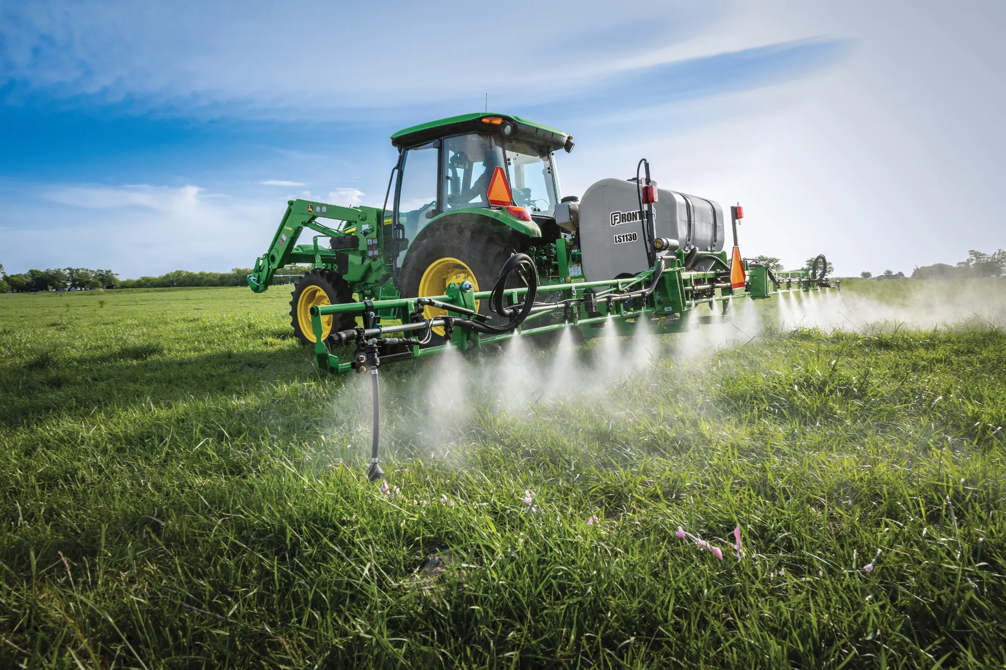 Field view of LS1130 Sprayer on 5075E Tractor in field