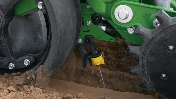 ExactShot delivers an exact dose of fertilizer in-furrow on a 1775NT 24Row30 drawn planter in-field