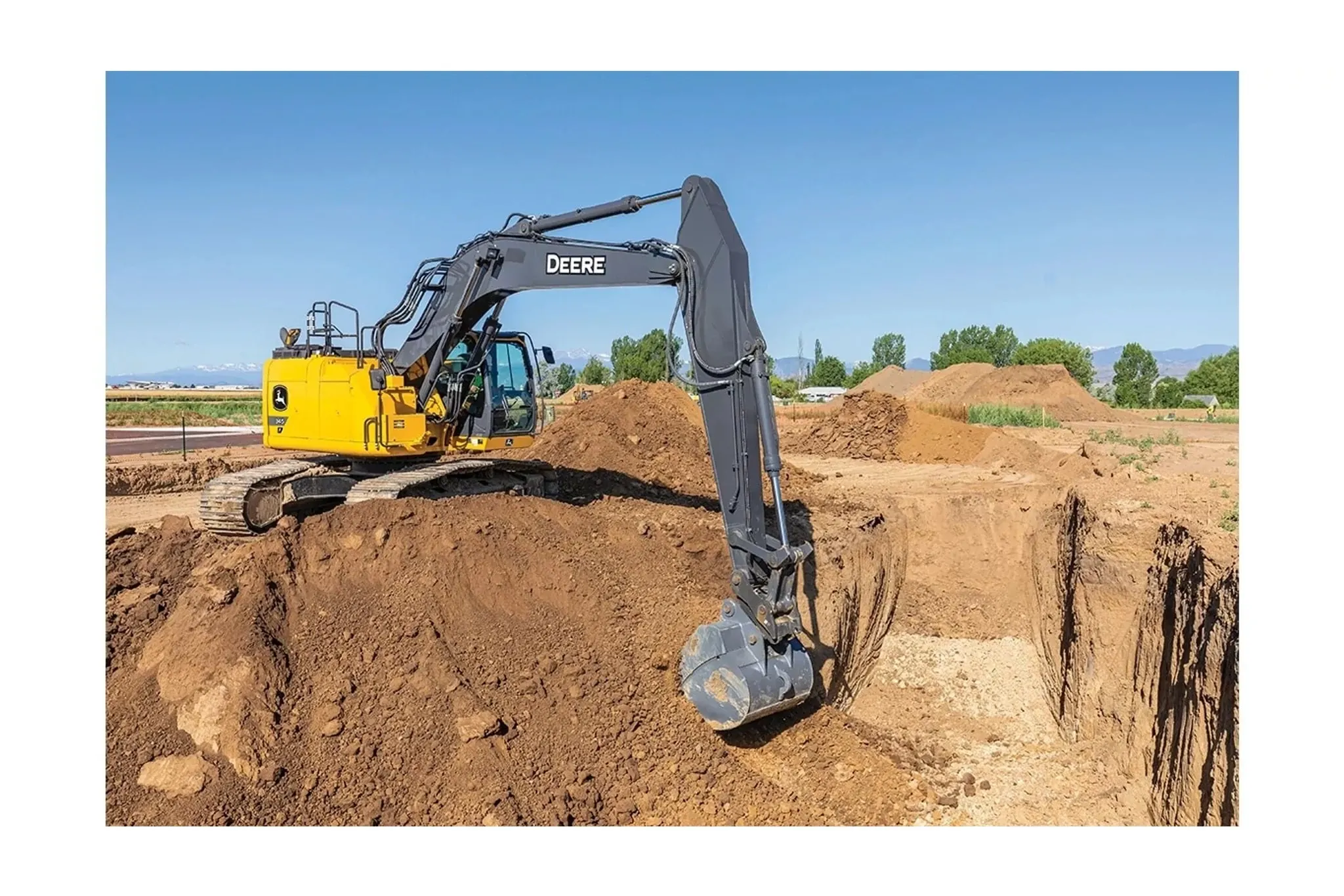 345 P-Tier Compact Excavator digging a foundation