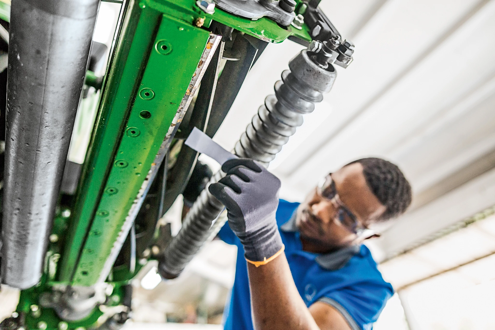 Technician working on 2653B PrecisionCut Mower