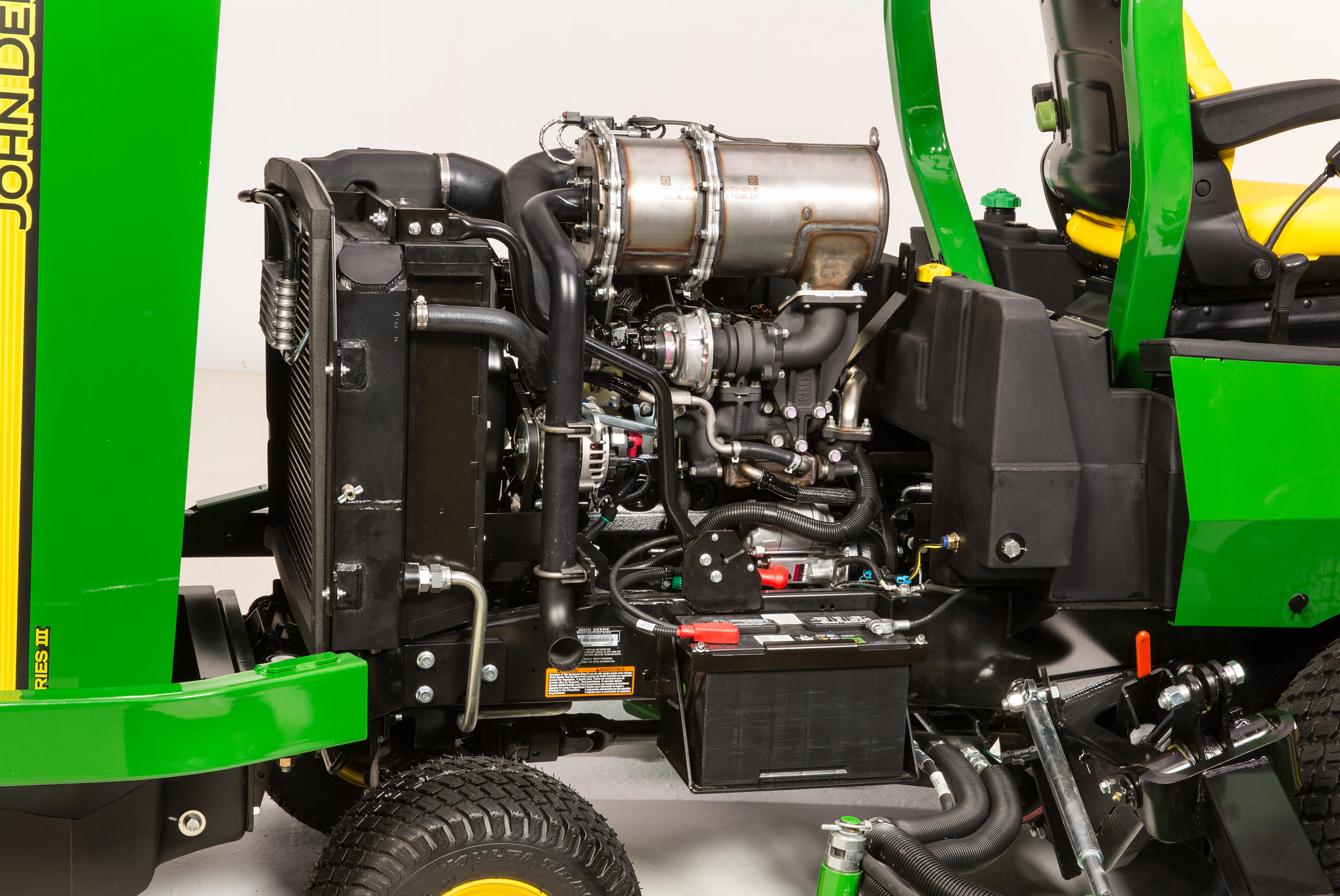 Side studio view of the uncovered diesel engine of a 1600 Turbo Series III wide area mower
