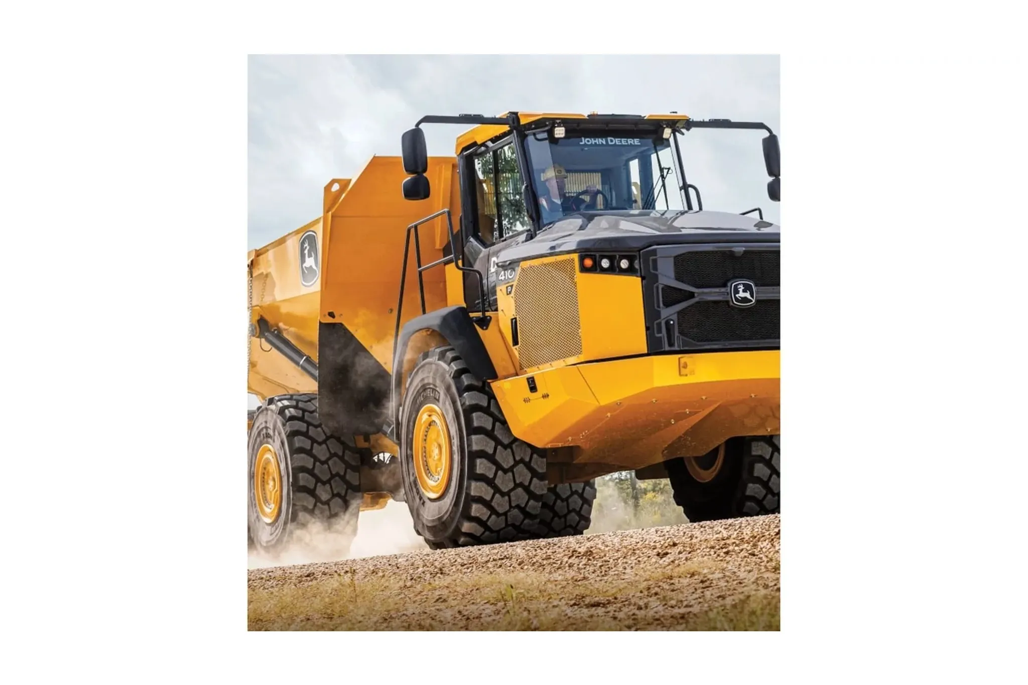 410 P-Tier Articulated Dump Truck driving on gravel
