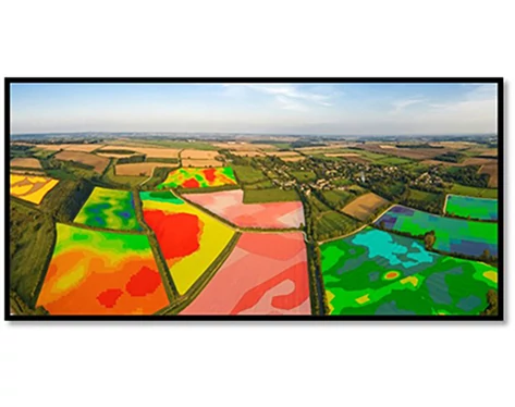 Computer screen showing heat-mapped parcels of land across many fields from above.