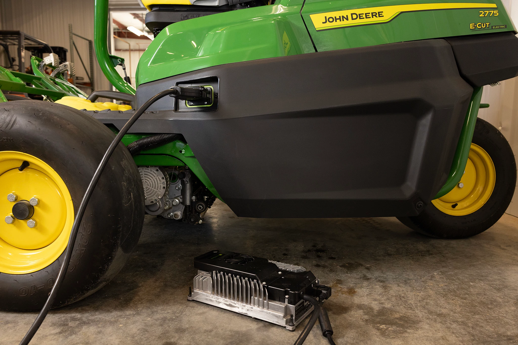 View of 2775 E-Cut Mower charging in a garage