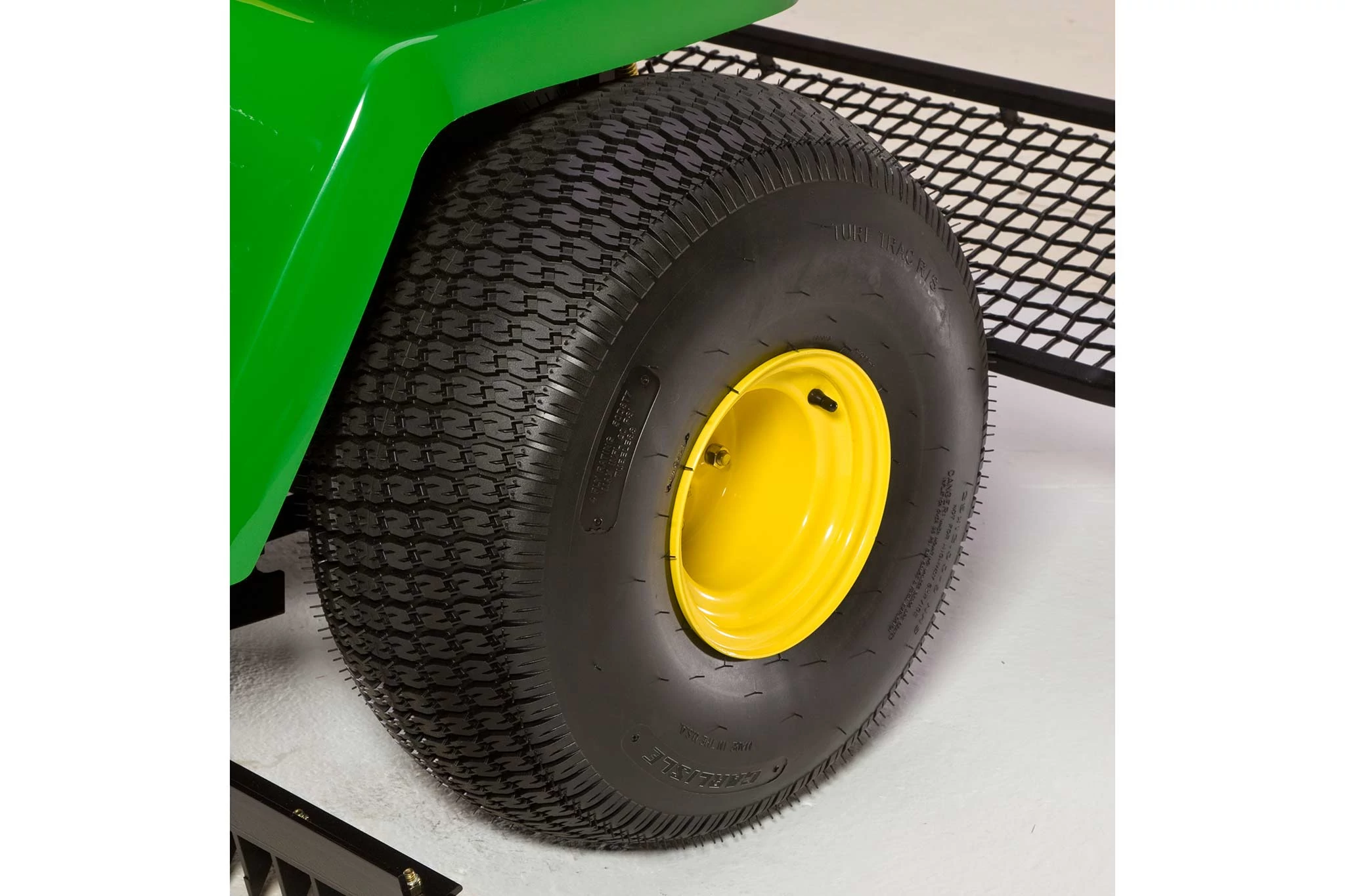 Angled studio view of a bunker and field rake's rear high flotation tire